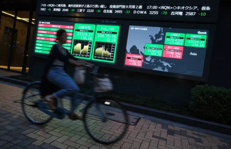 Asian markets drop as Fed signals end of pandemic-era cheap cash