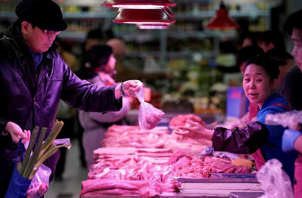 China inflation noses up in June on pork prices Business