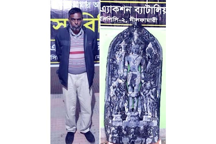 One held with a touchstone Vishnu idol in Birganj