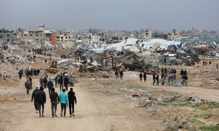 Palestinians back on key Gaza road as Israel withdraws