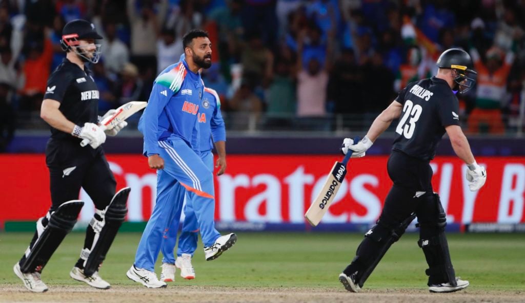 Chakravarthy stars as India set up Champions Trophy clash with Australia