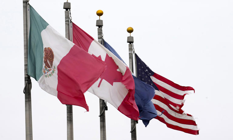 US tariffs on Canada, Mexico imports come into effect