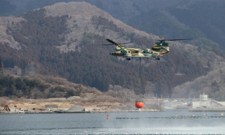 Rain, snow offer hope in Japan's worst wildfire in 50 years