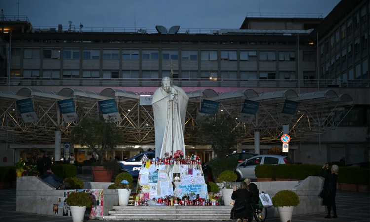Calm night for pope, Vatican says, as condition improves