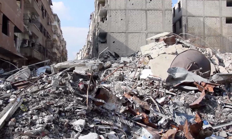 Blast from suspected old bomb in Syria kills 16