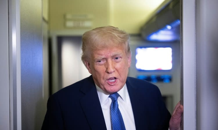 Trump veers towards courts clash over migrant flights