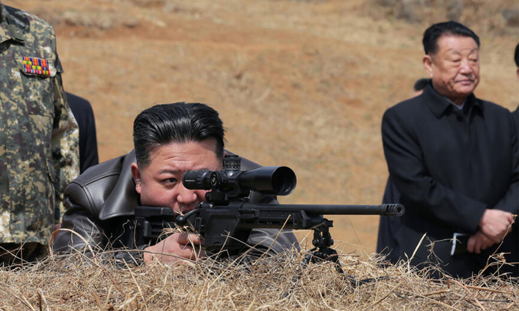 North Korea's Kim fires new sniper rifle while visiting troops