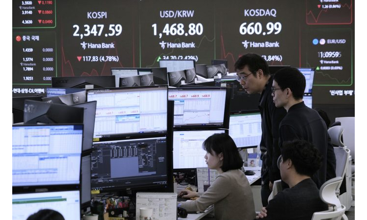 Japan's Nikkei dives, yen rallies as US tariffs bite