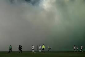 Ligue 1 derby interrupted after assistant referee hit by projectile