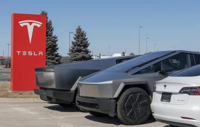 Tesla says profits plunge 71%, warns of 'changing political sentiment'