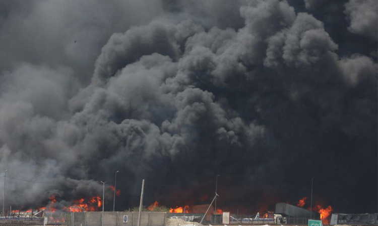 Iran minister blames 'negligence' for port blast that killed 70