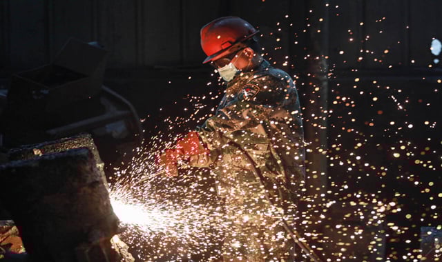 China's manufacturing shrinks in April as trade war bites