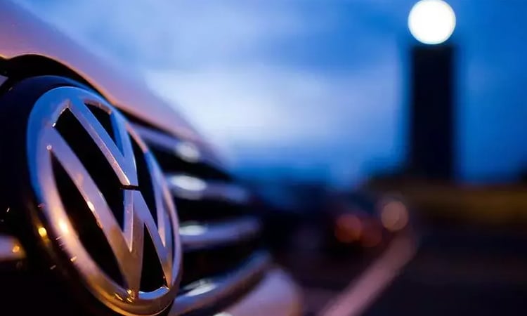 Volkswagen says tariffs will dampen business as profit plunges