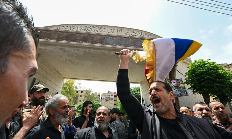 Syria reports Israeli strikes as clashes with Druze spread