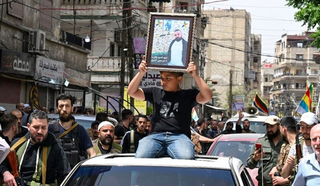 Syrian Druze leader slams 'genocidal campaign', Israel issues warning