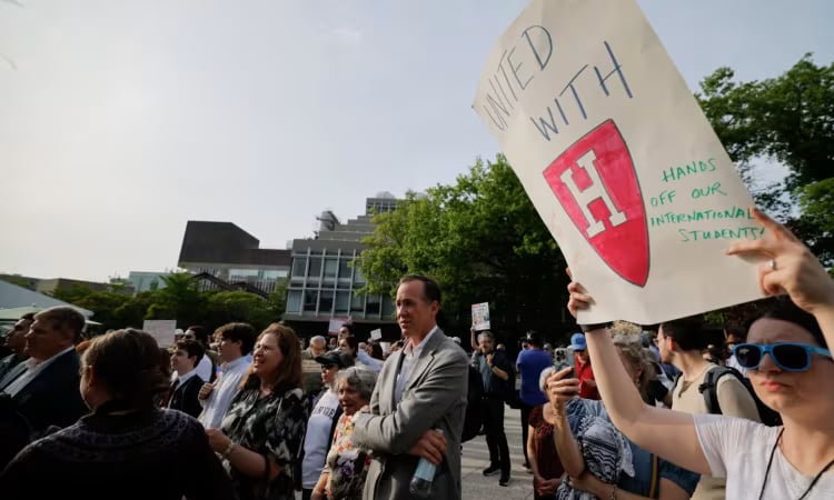 Harvard students march after Trump seeks to cut remaining contracts