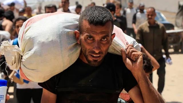 Thousands storm aid warehouse in Gaza as hunger crisis deepens