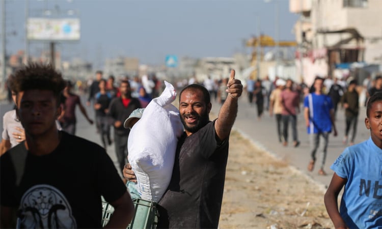 Thousands storm aid warehouse in Gaza as hunger crisis deepens