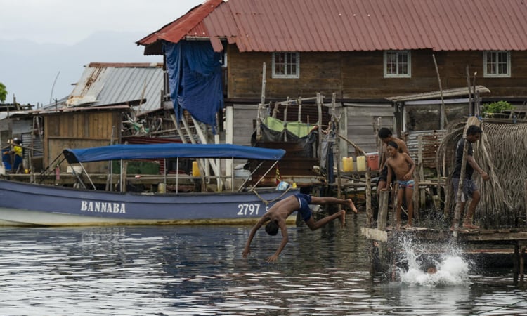 Year after exodus, silence fills Panama island threatened by sea