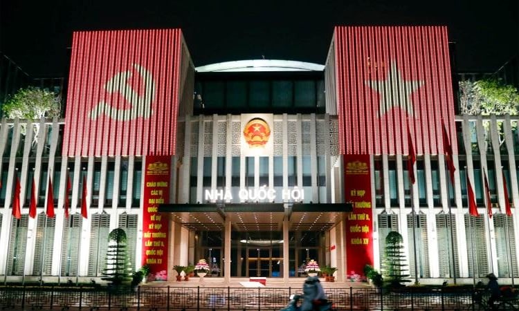 Vietnam lawmakers approve merging provinces, slashing nearly 80,000 jobs