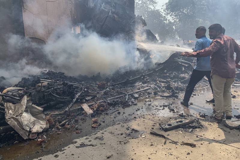 Flames and smoke in aftermath of crashed India passenger jet