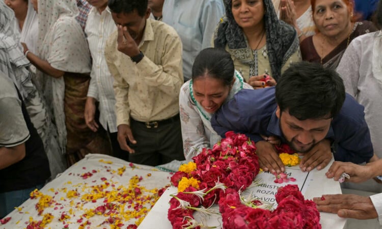 Relatives wait for remains after Air India crash