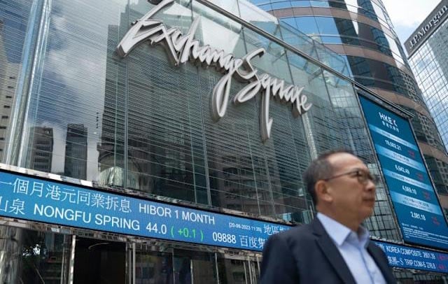 Asian stocks drop after Fed warning, oil dips with Mideast in focus
