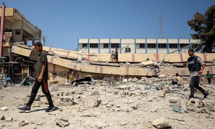 Gaza rescuers say Israeli forces kill 25, including 12 in shelter for displaced