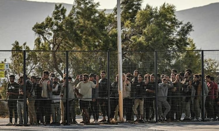 Greece detains first migrants arriving after asylum freeze
