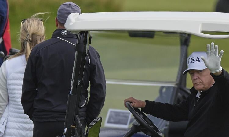 Trump plays golf in Scotland as protesters rally