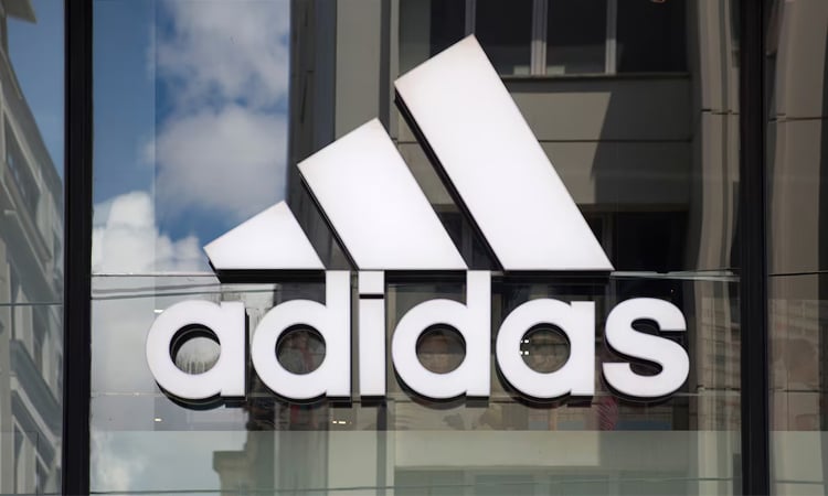 Adidas reports hit from US tariffs