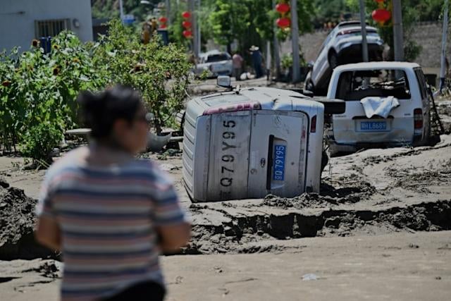 Beijing issues new storm warning after deadly floods     