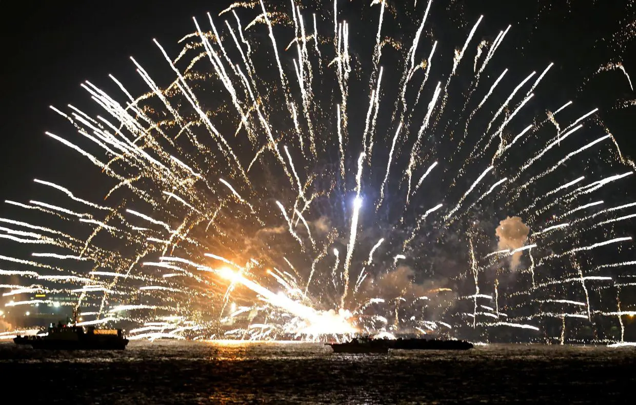 Barges carrying fireworks ablaze in Japan, five flee into sea