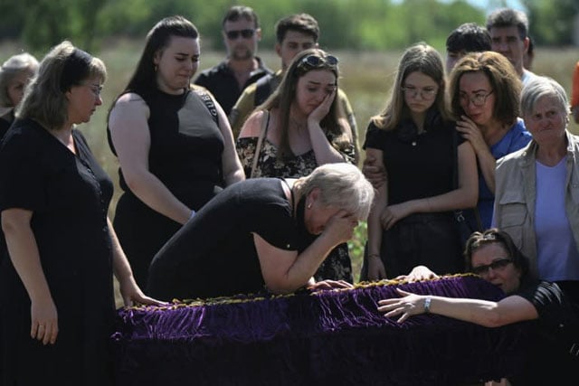 'Back home': family who fled front buried after Kyiv strike