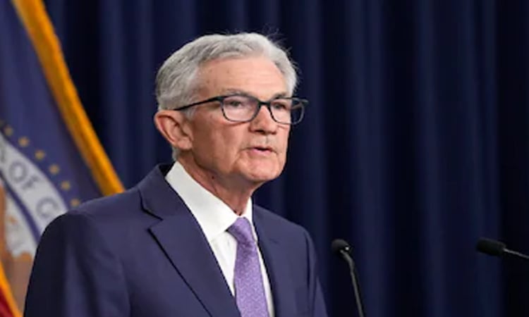 Dow hits fresh record after Fed chair signals possible rate cut