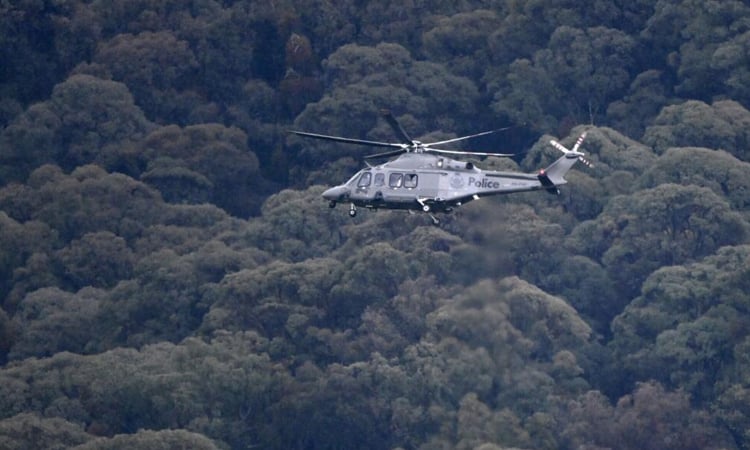 Police search Australian bush for gunman after two officers killed