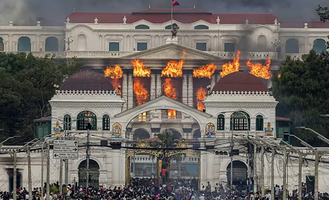 Nepal protesters set parliament ablaze as PM quits