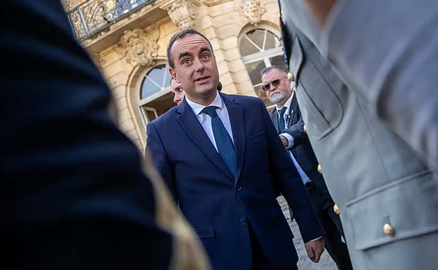 France's new PM courts the left a day after ratings downgrade