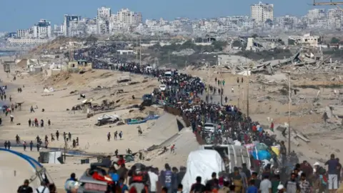 Palestinians return to devastated Gaza City as truce holds