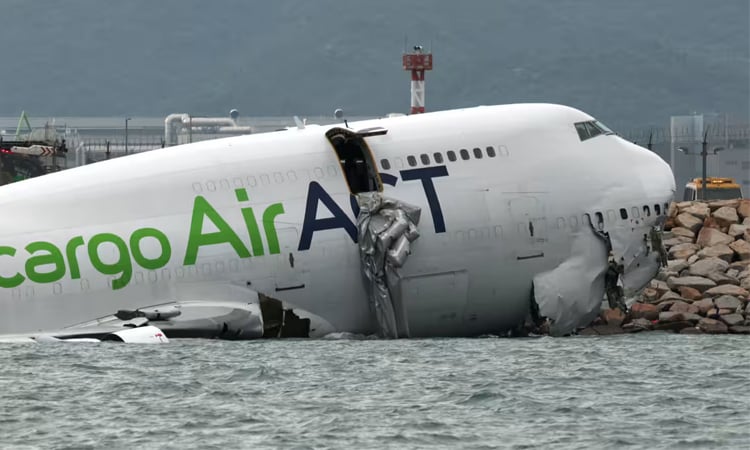Two killed as cargo plane skids off Hong Kong runway