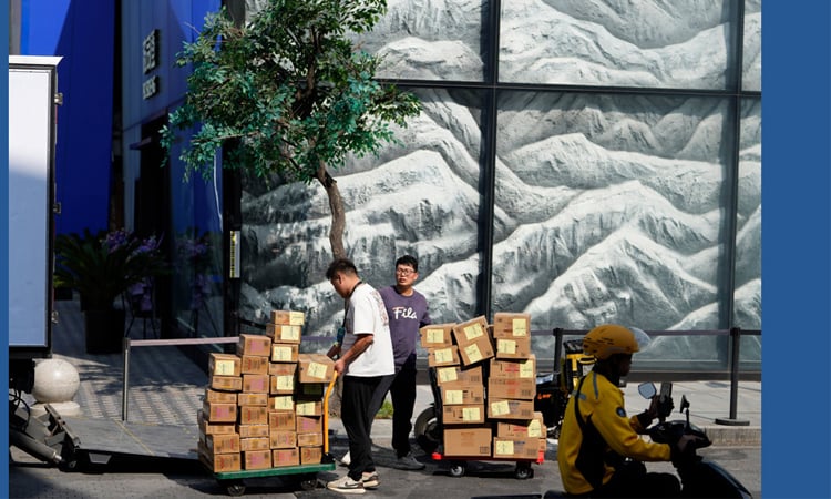 China says economy grew at slowest pace in a year in third quarter