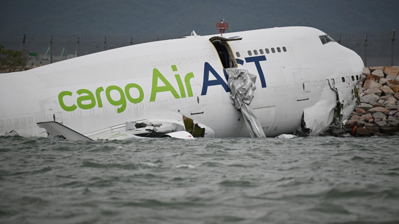 Cargo plane skids off Hong Kong runway, kills 2