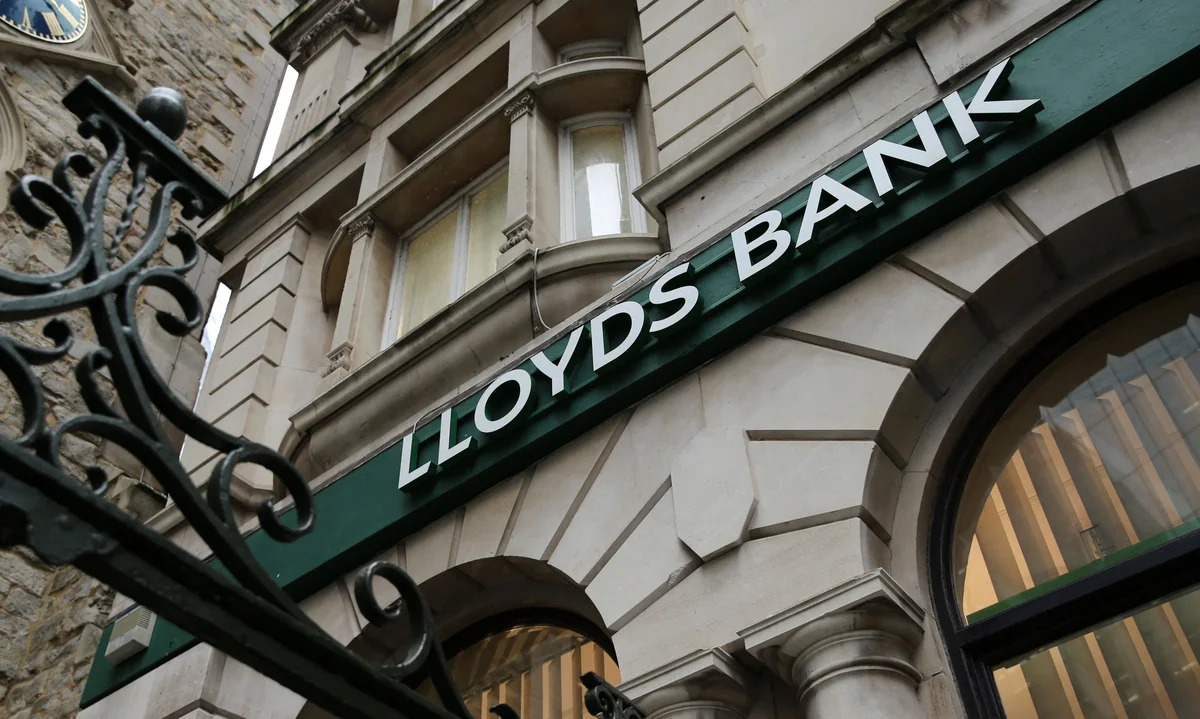 Lloyds bank says profits shrink on bad car loans
