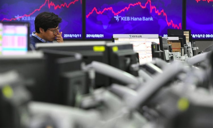 Asian markets tumble as tech bubble fears grow