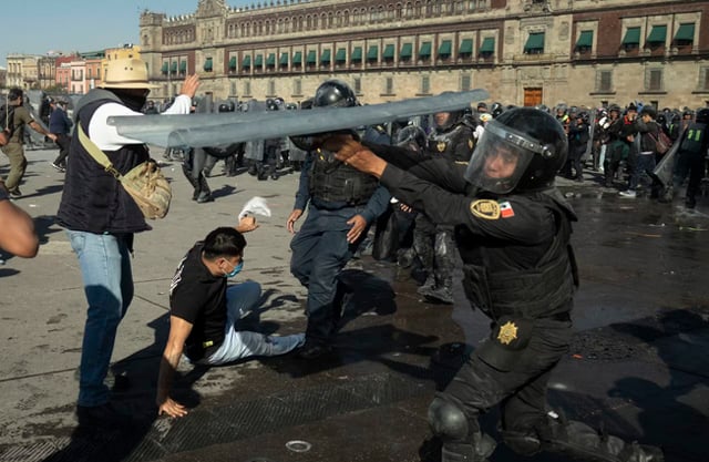 Clashes injure 120 at protest against Mexico president