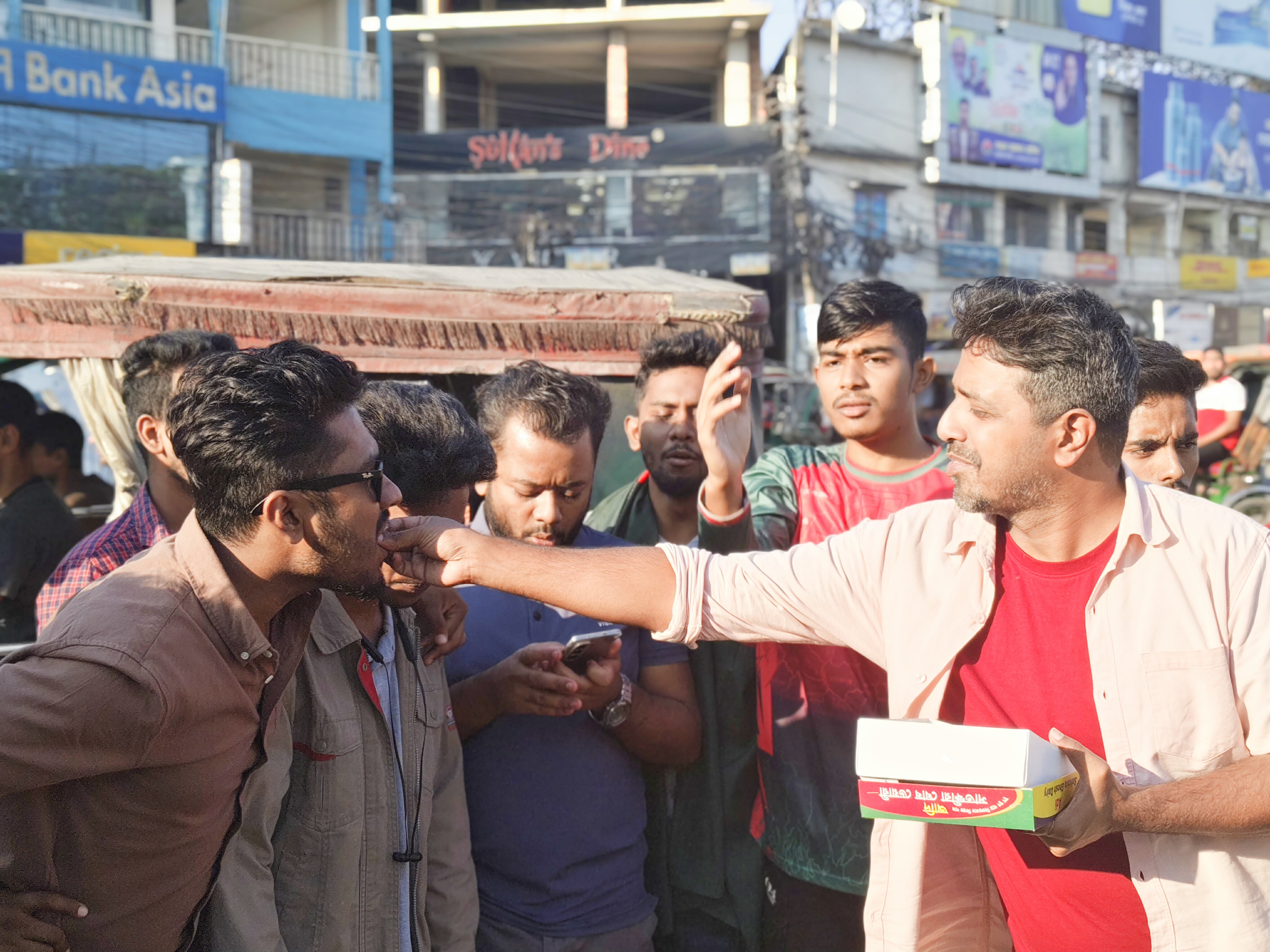 Students distribute sweets in Khulna after announcement of verdict against Hasina