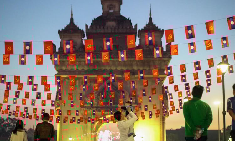 Please don't rush: slow changes in Laos 50 years after communist victory