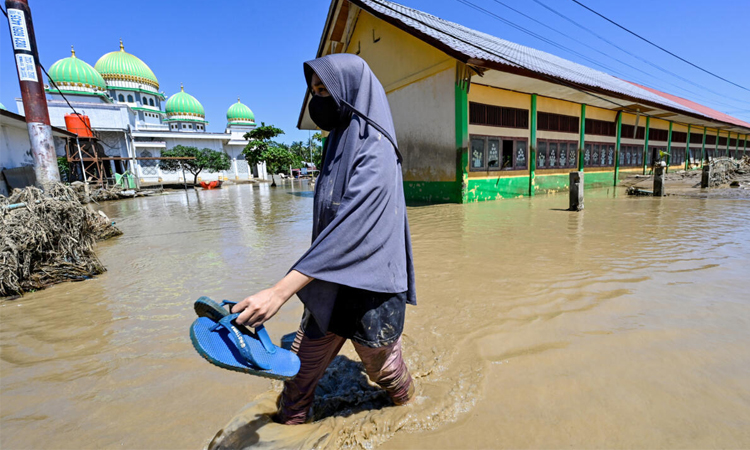 Race to get aid to Asia flood survivors as toll nears 1,200