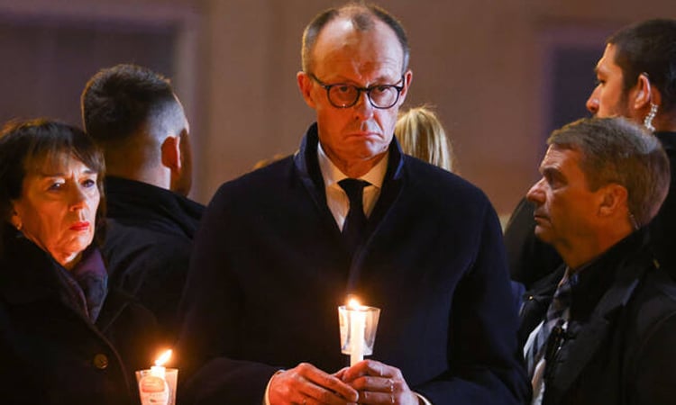 Germany's Merz urges 'peaceful coexistence' a year after deadly market attack