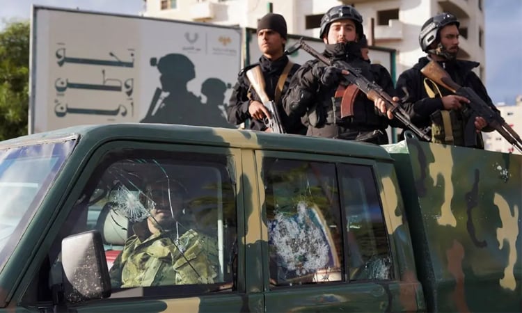 Syria arrests 21 linked to Assad rule as curfew covers port city